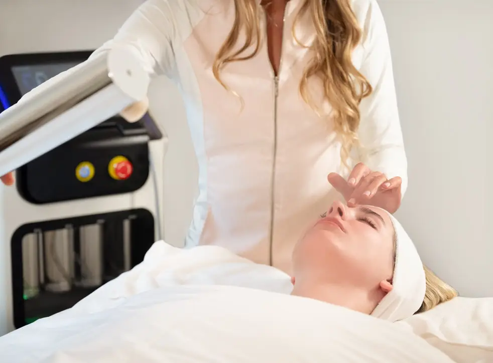 Woman receiving advanced facial skin treatment at professional medical spa clinic